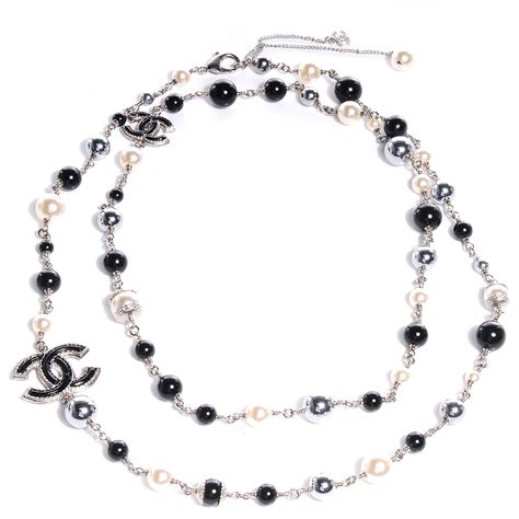 chanel pearl cc beaded long necklace black white|Chanel pearl necklace retail price.